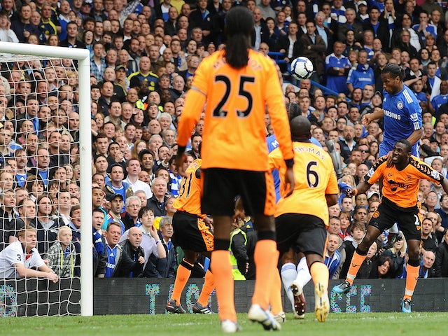 Chelsea's Ivorian striker Didier Drogba scores his second goal during the English Premier League football match between Chelsea and Wigan Athletic at Stamford Bridge in London, England on May 9, 2010
