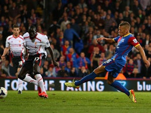 Dwight Gayle of Crystal Palace scores his team's third goal to level the scores at 3-3 during the Barclays Premier League match against Liverpool on May 5, 2014