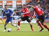 Fernando Torres of Chelsea moves away from Aron Gunnarsson during the Barclays Premier League match between Cardiff City and Chelsea at the Cardiff City Stadium on May 11, 2014