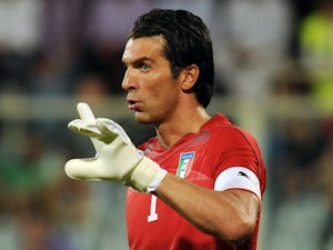 Buffon limps out of training