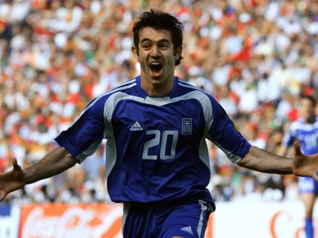 Midfielder Giorgos Karagounis celebrates scoring for Greece against Portugal on June 12, 2004.