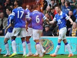James McCarthy (R) of Everton celebrates scoring the opening goal with team mates during the Barclays Premier League match between Hull City and Everton at KC Stadium on May 11, 2014