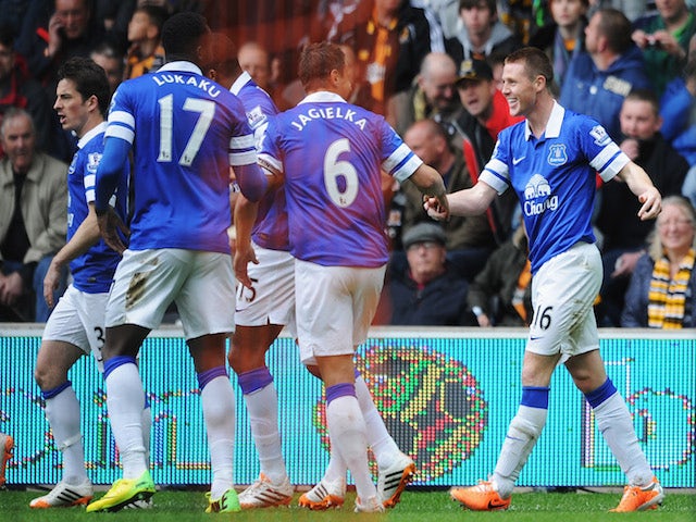 James McCarthy (R) of Everton celebrates scoring the opening goal with team mates during the Barclays Premier League match between Hull City and Everton at KC Stadium on May 11, 2014