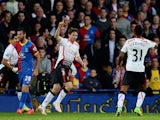 Joe Allen of Liverpool celebrates after scoring the opening goal during the Barclays Premier League match between Crystal Palace and Liverpool at Selhurst Park on May 5, 2014