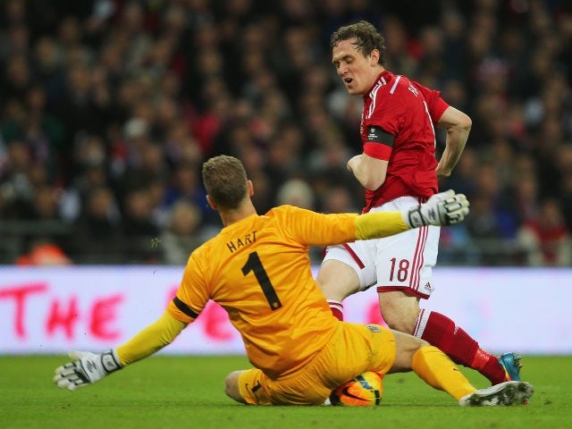 England goalkeeper Joe Hart makes a save against Denmark on March 05, 2014.