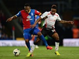 Kagisho Dikgacoi of Crystal Palace and Raheem Sterling of Liverpool battle for the all during the Barclays Premier League match on May 5, 2014