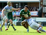 Manusamoa Tuilagi of Leicester Tigers is tackled by Michael Tagicakbau of Saracens during the Aviva Premiership match between Leicester Tigers and Saracens at Welford Road on May 10, 2014