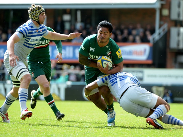 Manusamoa Tuilagi of Leicester Tigers is tackled by Michael Tagicakbau of Saracens during the Aviva Premiership match between Leicester Tigers and Saracens at Welford Road on May 10, 2014