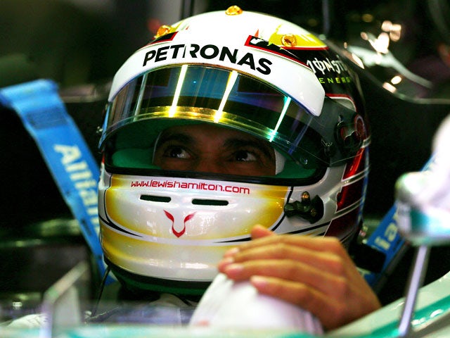 Lewis Hamilton of Mercedes sits in his car during a practise session of the F1 Spanish Grand Prix on May 9, 2014