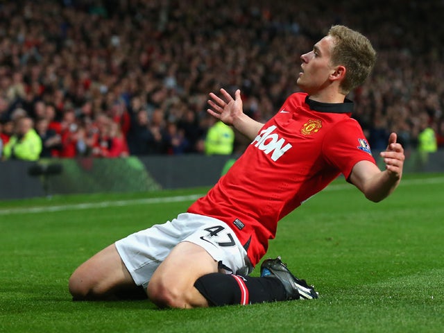 James Wilson of Manchester United celebrates scoring the second goal during the Barclays Premier League match between Manchester United and Hull City at Old Trafford on May 6, 2014