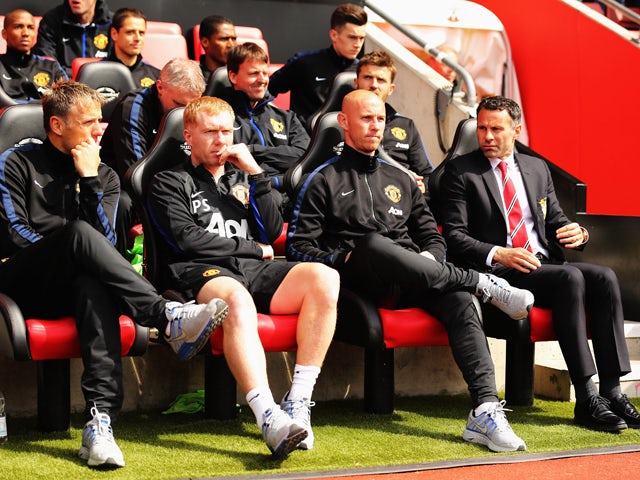 Manchester United interim manager Ryan Giggs looks on alongside assistants, Nicky Butt, Paul Scholes and Phil Neville before the Barclays Premier League match between Southampton and Manchester United at St Mary's Stadium on May 11, 2014