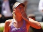 Maria Sharapova blows a kiss to the crowd after her three set victory against Na Li  in their quarter final Madrid Masters match on May 9, 2014