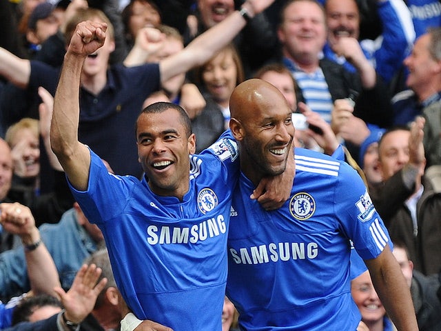 Nicolas Anelka (R) celebrates scoring the fourth goal with English defender Ashley Cole (L) during the English Premier League football match between Chelsea and Wigan Athletic on May 9, 2010