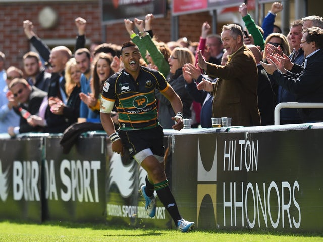 Luther Burrell of Northampton Saints celebrates after scoring a try during the Aviva Premiership match between Northampton Saints and London Wasps at Franklin's Gardens on May 10, 2014