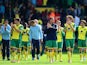 Norwich City players applaud the fans at the end of the match during the Barclays Premier League match between Norwich City and Arsenal at Carrow Road on May 11, 2014