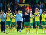 Norwich City players applaud the fans at the end of the match during the Barclays Premier League match between Norwich City and Arsenal at Carrow Road on May 11, 2014