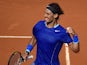 Spanish player Rafael Nadal celebrates after winning the men's singles semi-final tennis match against Spanish player Roberto Bautista Agut at the Madrid Masters at the Magic Box (Caja Magica) sports complex in Madrid on May 10, 2014