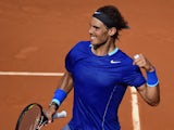 Spanish player Rafael Nadal celebrates after winning the men's singles semi-final tennis match against Spanish player Roberto Bautista Agut at the Madrid Masters at the Magic Box (Caja Magica) sports complex in Madrid on May 10, 2014