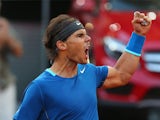 Rafael Nadal celebrates after winning a point against Kei Nishikori during the Madrid Masters final on May 11, 2014