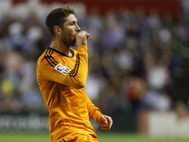 Real Madrid's defender Sergio Ramos celebrates after scoring during the Spanish league football match Real Valladolid FC vs Real Madrid CF at Jose Zorilla stadium in Valladolid on May 7, 2014