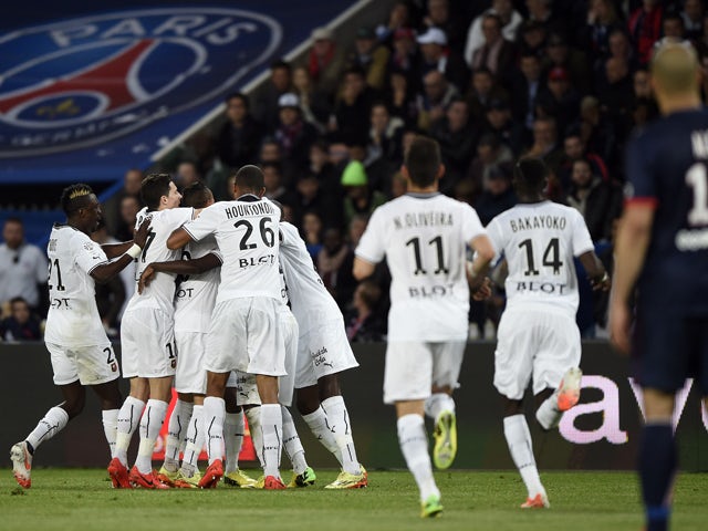 Rennes' players celebrate after scoring during the French L1 football match Paris Saint-Germain vs Rennes at the Parc Des Princes stadium in Paris on May 7, 2014
