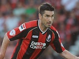 Richard Hughes of Bournemouth attacks during the Capital One Cup First Round match between AFC Bournemouth and Portsmouth at The Goldsands Stadium on August 06, 2013