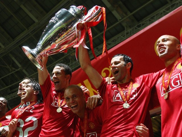 Manchester United teammates Rio Ferdinand and Ryan Giggs lift the Champions League trophy on May 21, 2008.