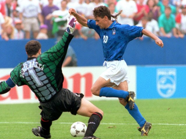 Italy striker Roberto Baggio rounds the goalkeeper on his way to scoring against Spain on July 09, 1994.