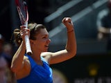 Romanian tennis player Simona Halep celebrates her victory over Czech tennis player Petra Kvitova during their women's singles semifinal tennis match of the Madrid Masters at the Magic Box (Caja Magica) sports complex in Madrid on May 10, 2014