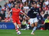 Luke Shaw of Southampton holds off Chris Smalling of Manchester United during the Barclays Premier League match between Southampton and Manchester United at St Mary's Stadium on May 11, 2014
