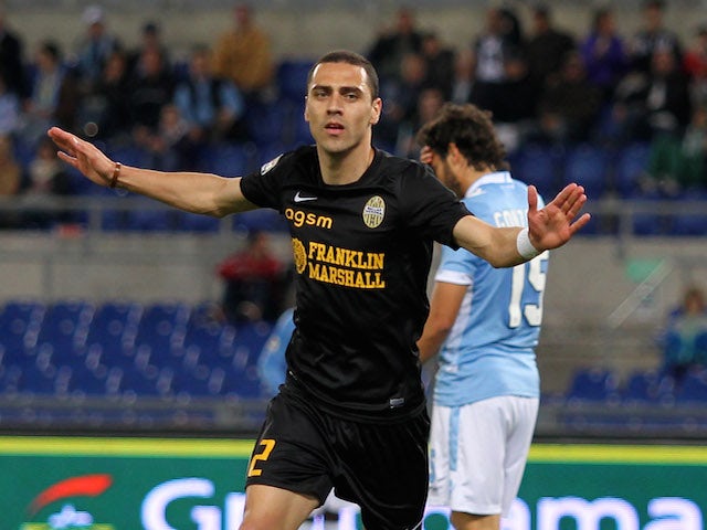 Souza Orestes Romulo of Hellas Verona celebrates after scoring his team's third goal during the Serie A match on May 5, 2014