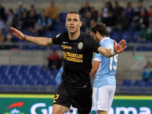 Souza Orestes Romulo of Hellas Verona celebrates after scoring his team's third goal during the Serie A match on May 5, 2014