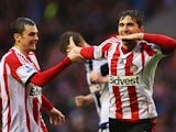  Fabio Borini of Sunderland celebrates with Adam Johnson as he scores their second goal during the Barclays Premier League match between Sunderland and West Bromwich Albion at Stadium of Light on May 7, 2014