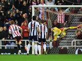 Jack Colback of Sunderland beats goalkeeper Ben Forster of West Bromwich Albion to score their first goal during the Barclays Premier League match between Sunderland and West Bromwich Albion at Stadium of Light on May 7, 2014