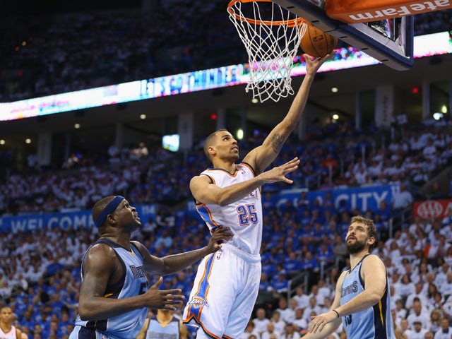 Thabo Sefolosha #25 of the Oklahoma City Thunder takes a shot against Zach Randolph #50 of the Memphis Grizzlies in Game Two of the Western Conference Quarterfinals during the 2014 NBA Playoffs at Chesapeake Energy Arena on April 21, 2014