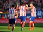 Atletico Madrid's Toby Alderweireld celebrates after scoring his team's first goal against Malaga during the La Liga match on May 11, 2014