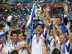 Greece captain Traianos Dellas lifts the European Championships trophy on July 04, 2004.