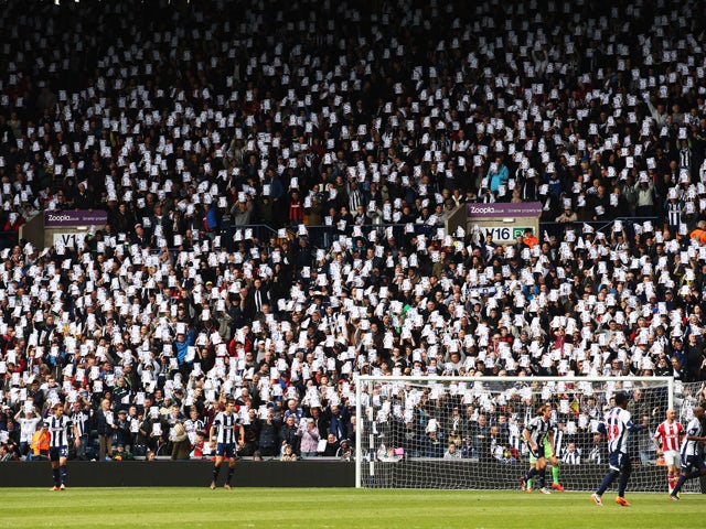 West Bromwich Albion fans hold 'Justice for Jeff' banners during the Barclays Premier League match between West Bromwich Albion and Stoke City at The Hawthorns on May 11, 2014