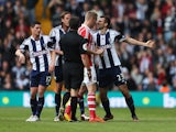 Gareth McAuley of West Bromwich Albion clashes with Ryan Shawcross of Stoke City as referee Lee Probert intervenes during the Barclays Premier League match between West Bromwich Albion and Stoke City at The Hawthorns on May 11, 2014