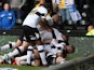 Derby's Will Hughes is mobbed by teammates after scoring the opening goal against Brighton during their play-off semi-final match on May 11, 2014