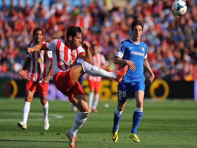 Almeria's defender Angel Trujillo (L) vies with Athletic Bilbao's forward Guillermo Fernandez Hierro during the Spanish league football match pm May 18, 2014