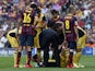 Atletico Madrid's Brazilian-born forward Diego da Silva Costa is checked due to a past injury during the Spanish league football match FC Barcelona vs Club Atletico de Madrid at the Camp Nou stadium in Barcelona on May 17, 2014