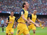 Diego Godin of Club Atletico de Madrid celebrates after scoring his goal during the La Liga match between FC Barcelona and Club Atletico de Madrid at Camp Nou on May 17, 2014