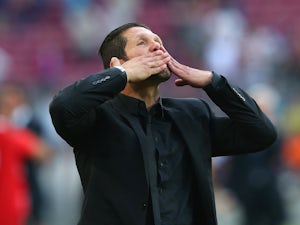 Diego Simeone the coach of Club Atletico de Madrid celebrates towards his supporters after winning the La Liga after the match between FC Barcelona and Club Atletico de Madrid at Camp Nou on May 17, 2014