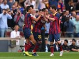 Alexis Sanchez of FC Barcelona celebrates with Lionel Messi after scoring the opening goal during the La Liga match between FC Barcelona and Club Atletico de Madrid at Camp Nou on May 17, 2014