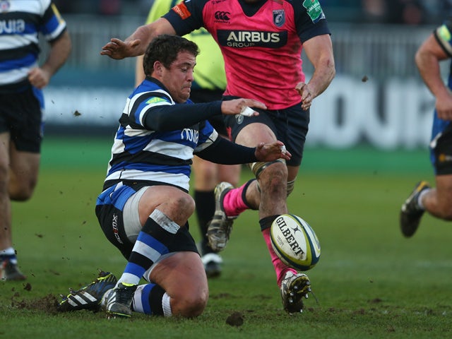 Eusebio Guinazu of Bath pounces on the loose ball as James Down of Cardiff Blues loses in during the LV Cup match between Bath and Cardiff Blues at the Recreation Ground on January 25, 2014