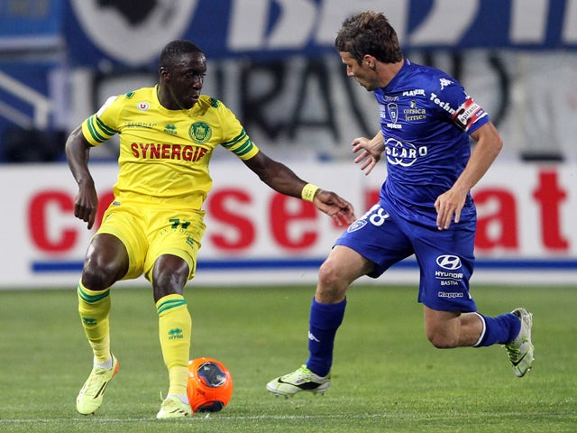 Nantes' French defender Issa Cissokho vies with Bastia's French midfielder Yannick Cahuzac during the French L1 football match Bastia (SCB) against Nantes (FCN) on May 17, 2014