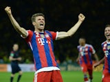 Bayern Munich's midfielder Thomas Muller celebrates scoring the second goal during the extra-time of the DFB German Cup final football match BVB Borussia Dortmund vs Bayern Munich at the Olympic Stadium in Berlin on May 17, 2014