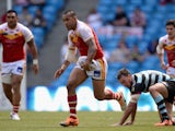 Jeff Lima of Catalan Dragons gets past Nick Slyney of London Broncos during the Super League match between London Broncos and Catalan Dragons at Etihad Stadium on May 17, 2014