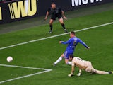 Fernando Torres of Chelsea rounds goalkeeper Artur of Benfica to score the opening goal during the UEFA Europa League Final between SL Benfica and Chelsea FC at Amsterdam Arena on May 15, 2013